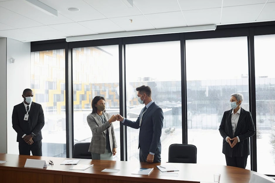 A modern office boardroom with a team engaged in a strategic discussion.